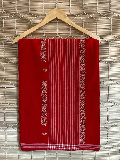Another beautiful red handloom saree from our Chikankari series. The placement of the embroidered motifs adds a touch of elegance and grace to the classic drape.