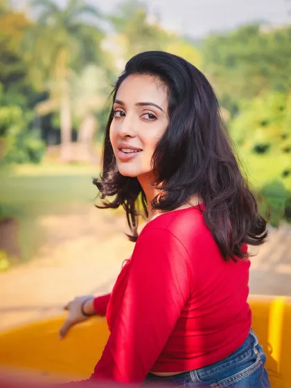 A bright and sunny outdoor portrait. This kind of shot is great for a portfolio, showing a model's natural beauty and approachable charm in a casual setting.