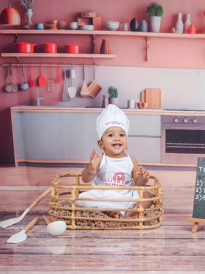 Waving from his basket in the kitchen. The detailed backdrop makes it look like a real miniature kitchen set.
