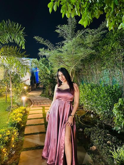 A full, smiling shot in the Azmat Official gown. This captures the joy and confidence that comes from wearing a beautiful piece.