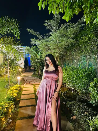 A full, smiling shot in the Azmat Official gown. This captures the joy and confidence that comes from wearing a beautiful piece.