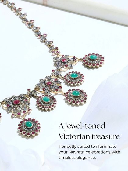 A product shot of the Victorian Opulence necklace, detailing its jewel-toned treasure of rubies and emeralds. This piece is perfectly suited to illuminate festive celebrations with timeless elegance.