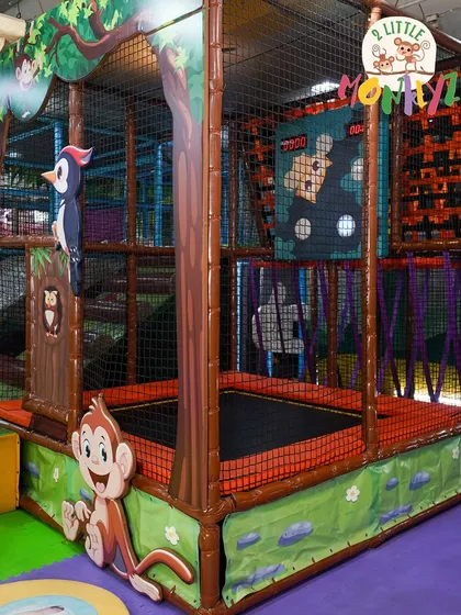 Jump into our jungle-themed trampoline park! It's fully netted for safety, so your little monkeys can bounce and burn off energy. The area includes a fun digital interactive game to make jumping even more exciting.