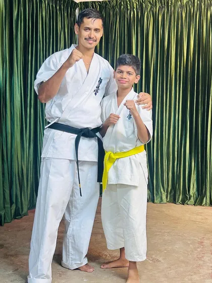 With a young yellow belt student at the Ooty camp. Every journey begins with a single step, and I am here to guide them.