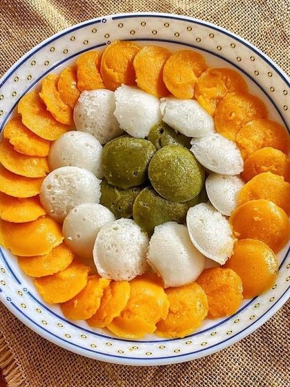 Tricolor idlis made with natural coloring from carrots and spinach. A festive and healthy way to enjoy a South Indian classic.