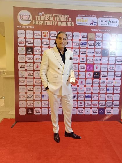 Posing with my award at the 19th Annual International Tourism, Travel & Hospitality Awards.