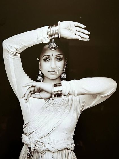 A sepia-toned portrait capturing the essence of a courtesan from history. This photoshoot was a beautiful exploration of historical characters through costume, pose, and expression.