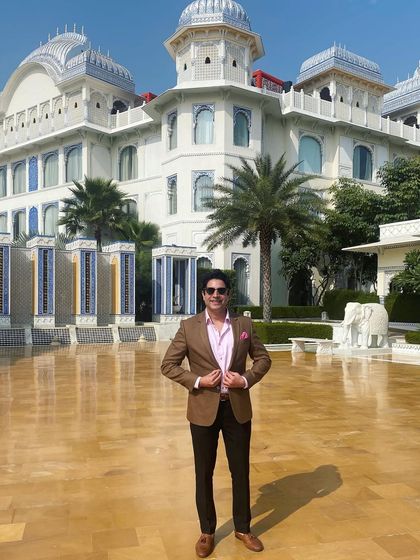 A smart-casual look at the Leela Palace Jaipur. The blend of modern and traditional architecture is a hallmark of luxury Indian hotels.