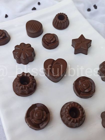 Another view of my homemade chocolates, highlighting the heart shaped and flower shaped pieces. These make for a lovely and delicious gift.
