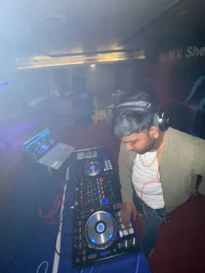 A smoky, atmospheric shot from a club gig. I'm comfortable in any club environment, reading the crowd and playing the tracks that hit just right.