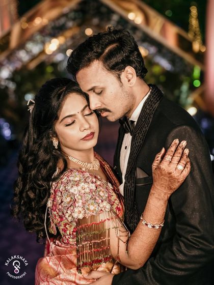 An intimate and emotional portrait of the couple at their wedding reception.