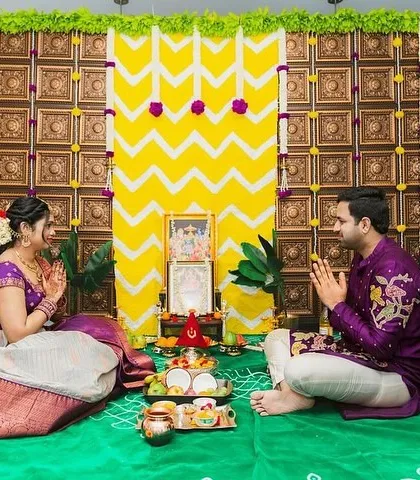The couple during a traditional ceremony, their coordinated outfits adding to the beauty and sanctity of the moment.