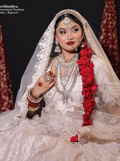 This portrait showcases a confident bride. The airbrush makeup technique taught in my course ensures a flawless, long-lasting finish, perfect for white outfits.