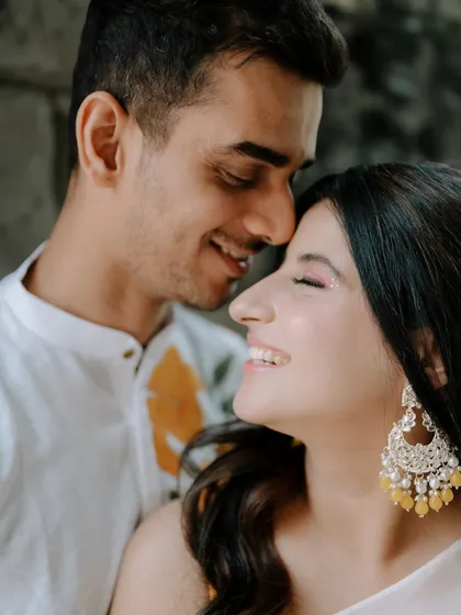 A joyful close-up of Divya and Chaitanya. The focus is entirely on their happy expressions and the connection they share.