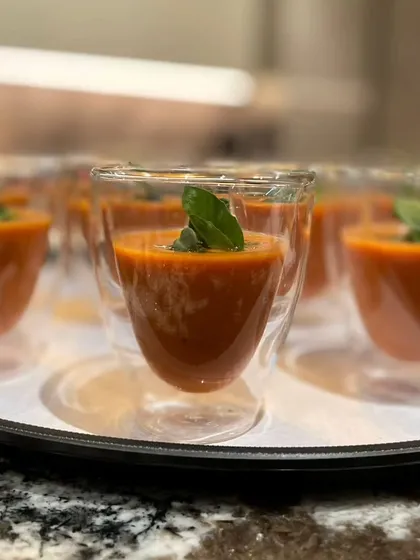 Perfect for a summer evening, our refreshing and cool Gazpacho is a favourite among guests, served in elegant double-walled glasses.