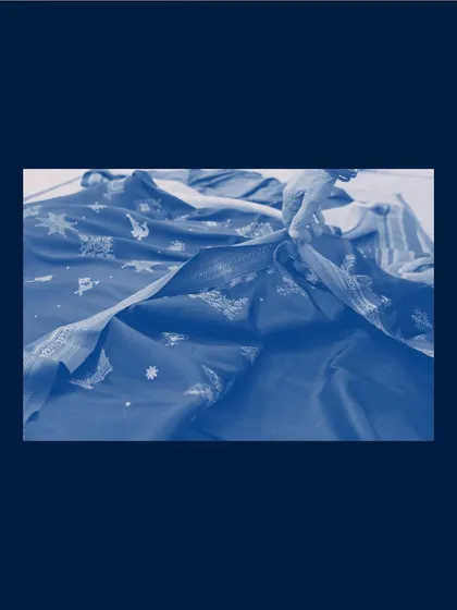 A beautiful cyanotype on fabric, created as part of the "Inheritance" project, exploring themes of memory and material.