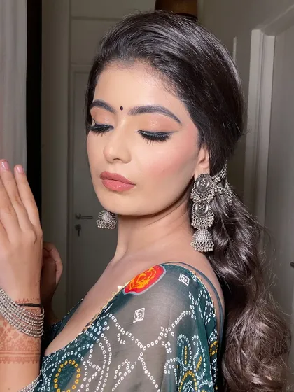 A close-up of the eye makeup. It's a simple yet effective look with a clean wing and soft brown eyeshadow, perfect for someone who doesn't want heavy makeup.