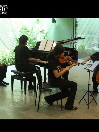 Our piano trio in performance, demonstrating the intricate collaboration required to play chamber music at a high level.