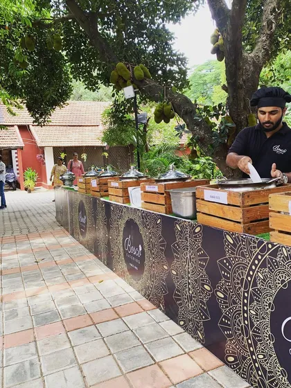 We bring authentic flavors to your event with live cooking stations. Here, our chef is preparing fresh appams, a traditional favorite that adds a special touch to any menu, be it a wedding or a family get-together.