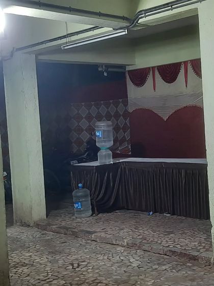 Even in compact spaces like a building's parking area, we can set up a functional service station. Here, we arranged a table for food and a water dispenser for guest convenience.