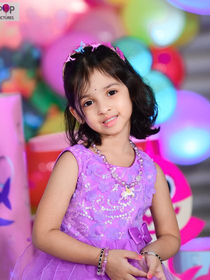 A vibrant 'Encanto' themed birthday party, with colorful floral decor, character cutouts, and a custom backdrop of the magical casita, bringing the magic of Colombia to your event.