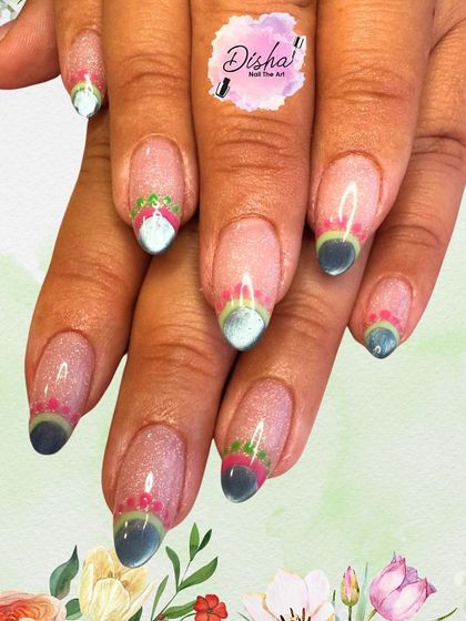 Blooming tips with a touch of sparkle. This design features colorful, floral-inspired tips on a shimmery, sheer base.