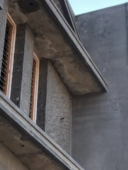 The "Sanman" residence under construction. This image shows the raw concrete structure, with the window placements and projections matching the initial 3D design.