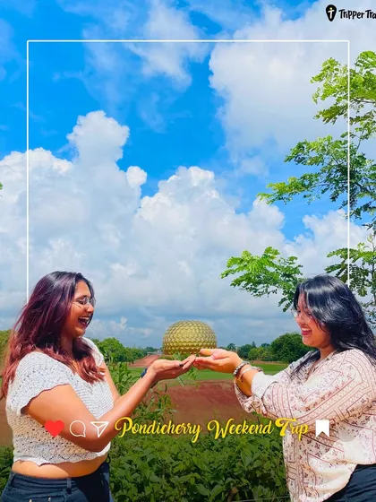 A fun shot of two women holding up the Matrimandir globe in Auroville, Pondicherry. This is one of the many Insta-worthy moments you can capture on my trips.