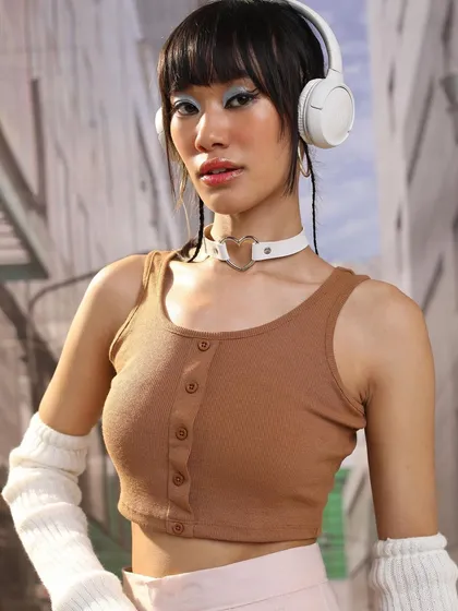This shot highlights the details of the K-pop inspired styling. The textures of the ribbed top and knit arm warmers, combined with the sleek choker, create a visually interesting and on-trend outfit.