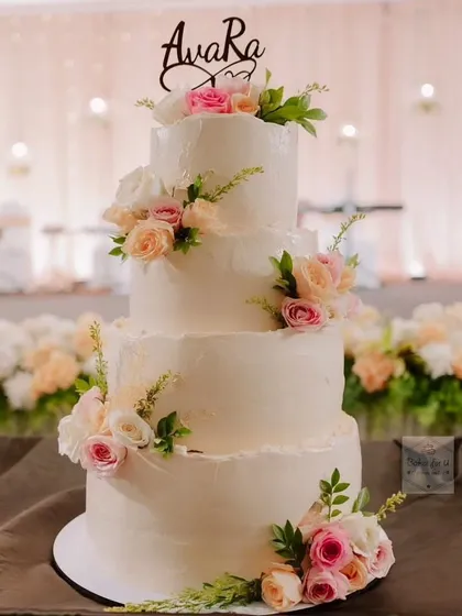 For this beautiful Pune wedding, I created a 20kg, four-tiered Boho-themed masterpiece. Frosted with rustic-style buttercream and filled with fresh berries, it was adorned with real flowers and 24k gold leaf for a touch of elegance. I personally handled the delivery and setup to ensure it was perfect for the couple's special day.