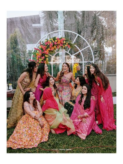 A fun group portrait of Arya and her bridesmaids. The rain adds a touch of unexpected magic and spontaneity to this joyful moment.
