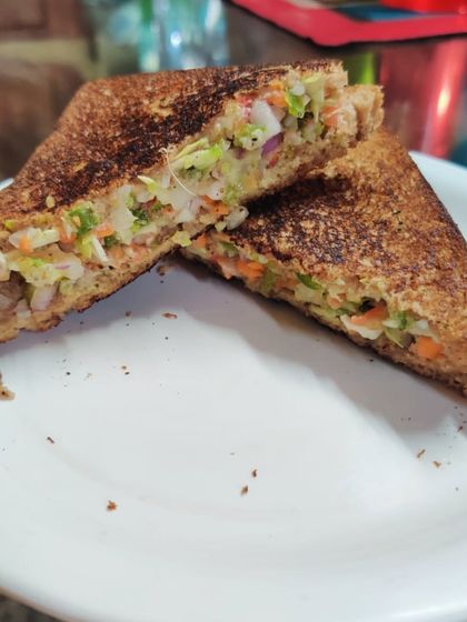 A toasted vegetable sandwich, a simple and satisfying meal that can be part of a successful weight loss plan.