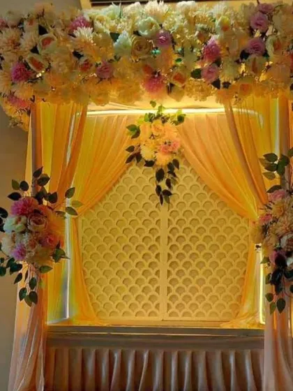 A warm and inviting setup for your festival, this design uses soft pastel colors and beautiful floral arrangements to create an elegant look.