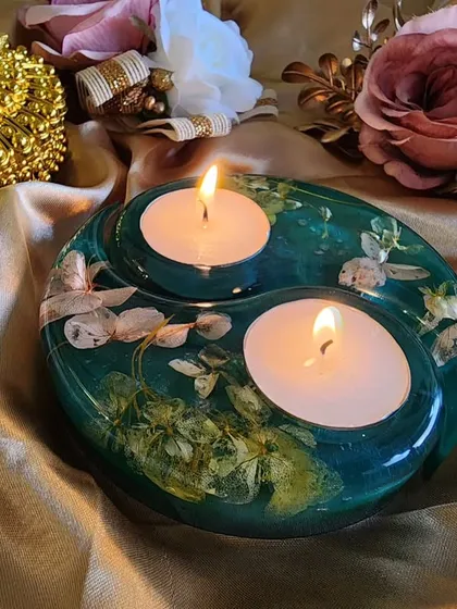 Another view of the teal resin tealight holder, a perfect way to light up the lamps of joy.