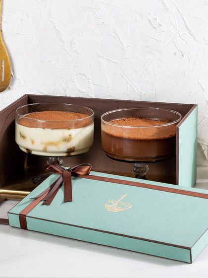 This gift set pairs two classic favorites: my rich Dark Chocolate Mousse and the coffee-infused Classic Tiramisu. It's the perfect gift for the dessert purist.