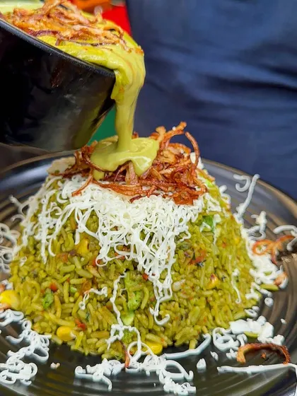 My Thai Green Curry with rice is a flavorful and aromatic dish, topped with fried onions and cheese for a unique twist.
