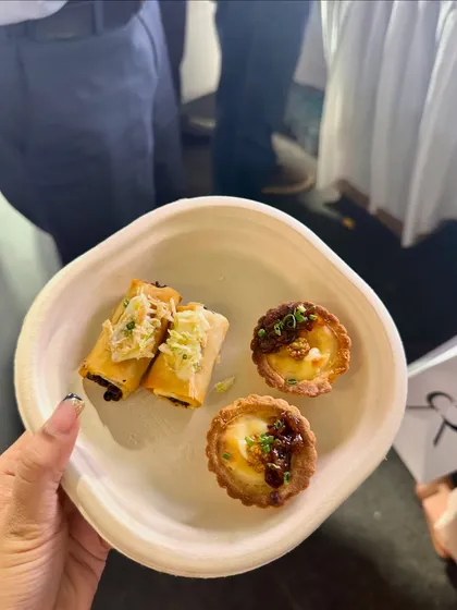 A plate holding a Truffle Mushroom Éclair and a Baked Brie Tart, two of our signature bites from the pop-up.