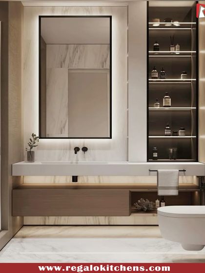 Clean lines and a minimalist aesthetic define this vanity. It features a floating countertop, an open storage niche, and a large, backlit mirror for a modern look.