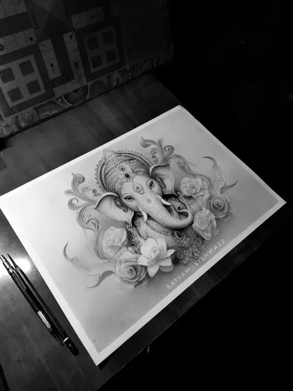 A different angle of the floral Ganesha sketch, showing the delicate pencil work in the lotus and rose petals that frame him.