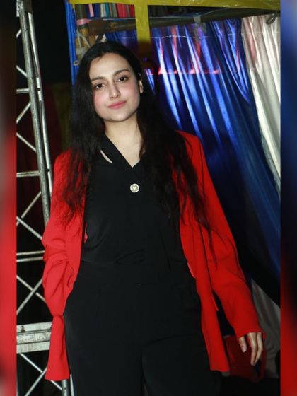 A backstage photo where my hair was a bit messy, but the energy was high. It's a reminder that live performances are all about passion, not perfection.