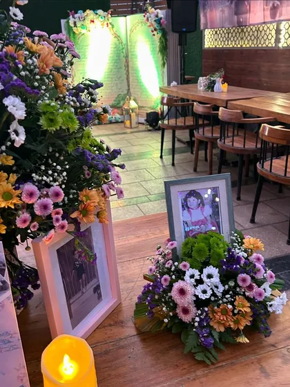 Personal touches like framed photos and candles are placed throughout the venue to create a warm and intimate atmosphere.