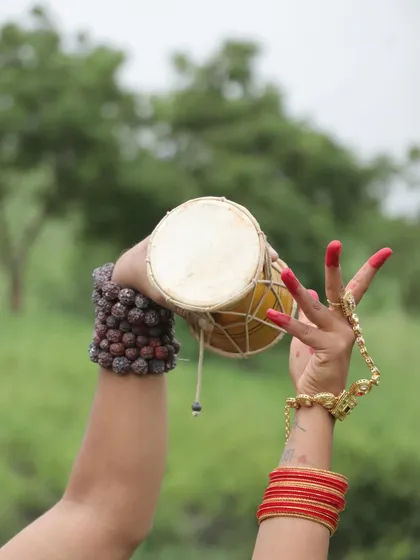 A symbolic shot of the 'damaru' and Parvati's 'mudra'. This shows how makeup and props work together to tell a complete story.