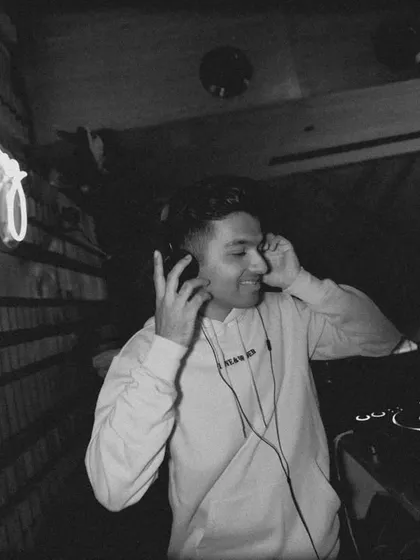 In my element, listening to the mix. A quiet moment of focus and enjoyment before the next track drops.
