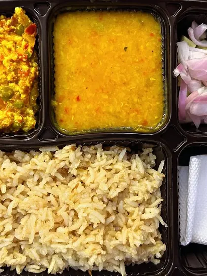 Another look at my healthy brown rice thali. This one comes with Paneer Bhurji, yellow dal, and salad, offering a balanced and tasty meal.