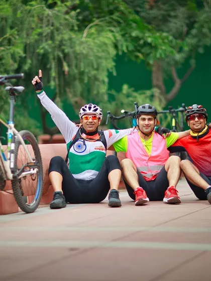 Three members celebrating after a ride. The sense of accomplishment is best shared with friends.