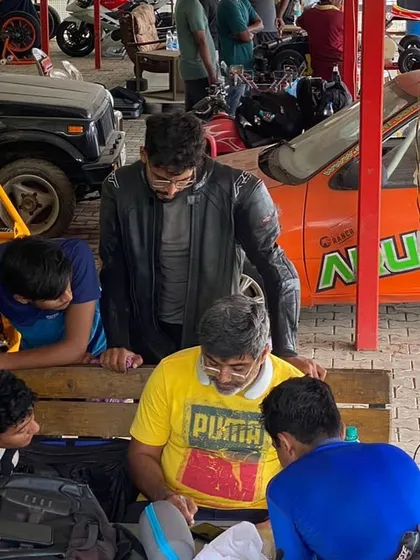 Our theory sessions are interactive and focused on problem solving. Here, a group of riders analyzes track maps and discusses race scenarios with me to sharpen their strategic thinking.