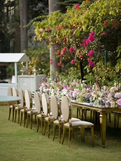 Another angle of the long table, showing the elegant chairs and the bar setup in the background. I ensure every part of the event space is cohesive and beautifully styled.