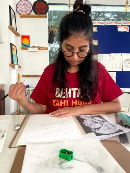 A student in our sketching course working on a detailed portrait. The course covers fundamentals like shading, proportion, and texture.