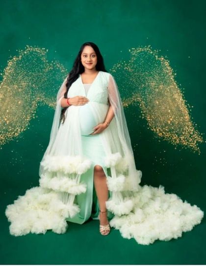 Feel like an angel in our mint green ruffled gown, complete with sparkling wing effects for a truly magical portrait.