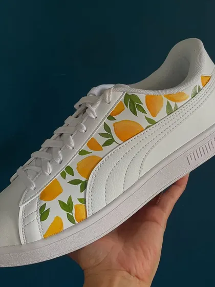 A fresh and fruity design. I hand-painted this lemon pattern on a pair of white Puma sneakers.